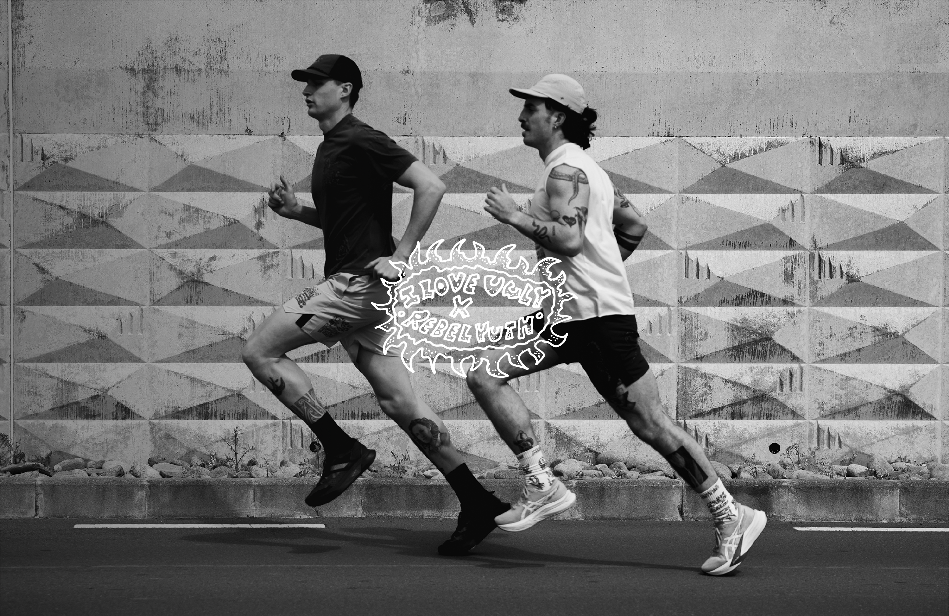 Two men running side by side in black and white.