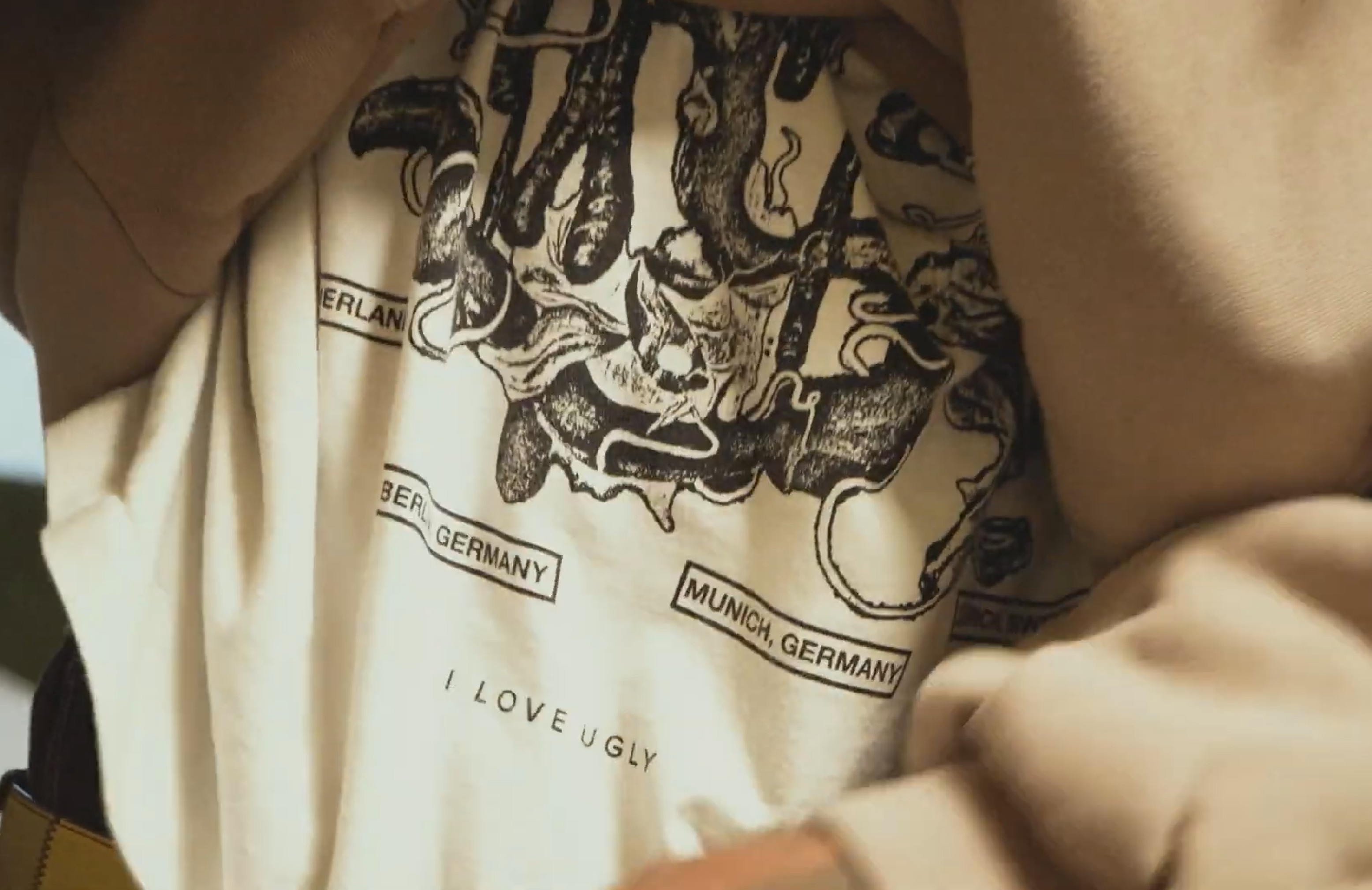 Close-up of a graphic design on a light-colored shirt.